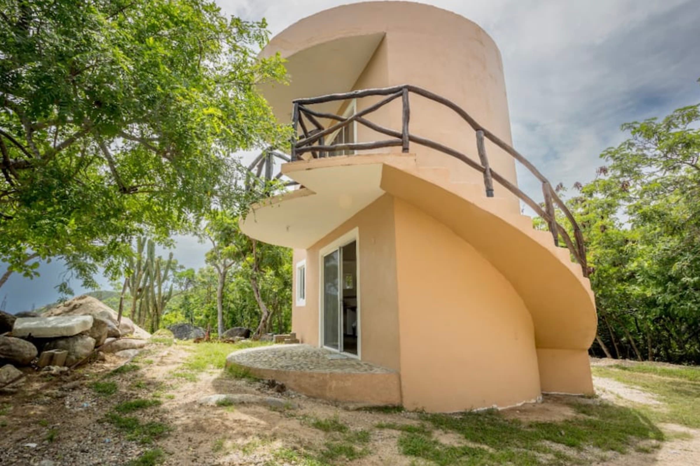 The cylindrical tower bungalow with a spiral staircase